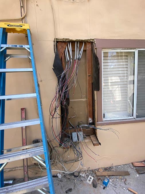 Hardwired EV charger installed on an exterior wall